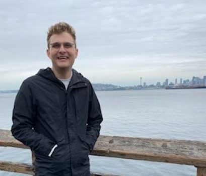 Liam Barrett standing on pier in Seattle
